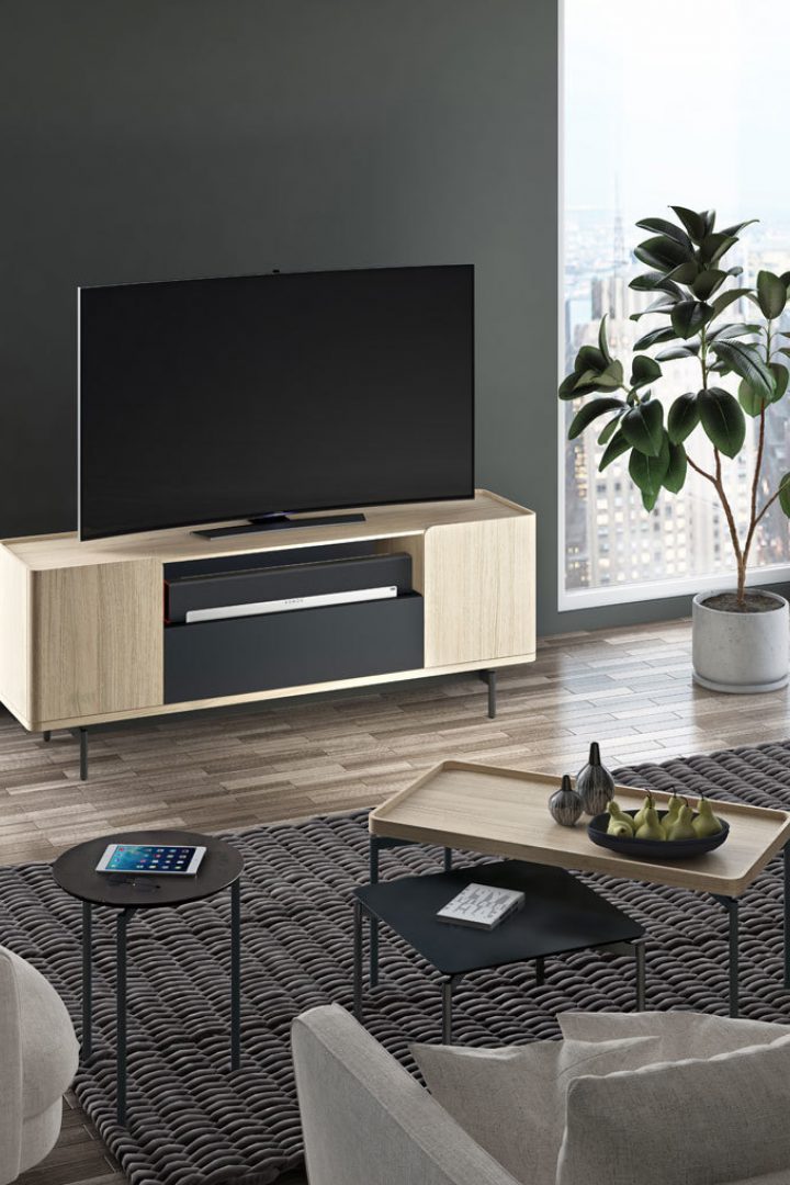 The Radius 8839 entertainment console and credenza is paired with the unique and equally beautiful Radius tables by BDI Furniture.