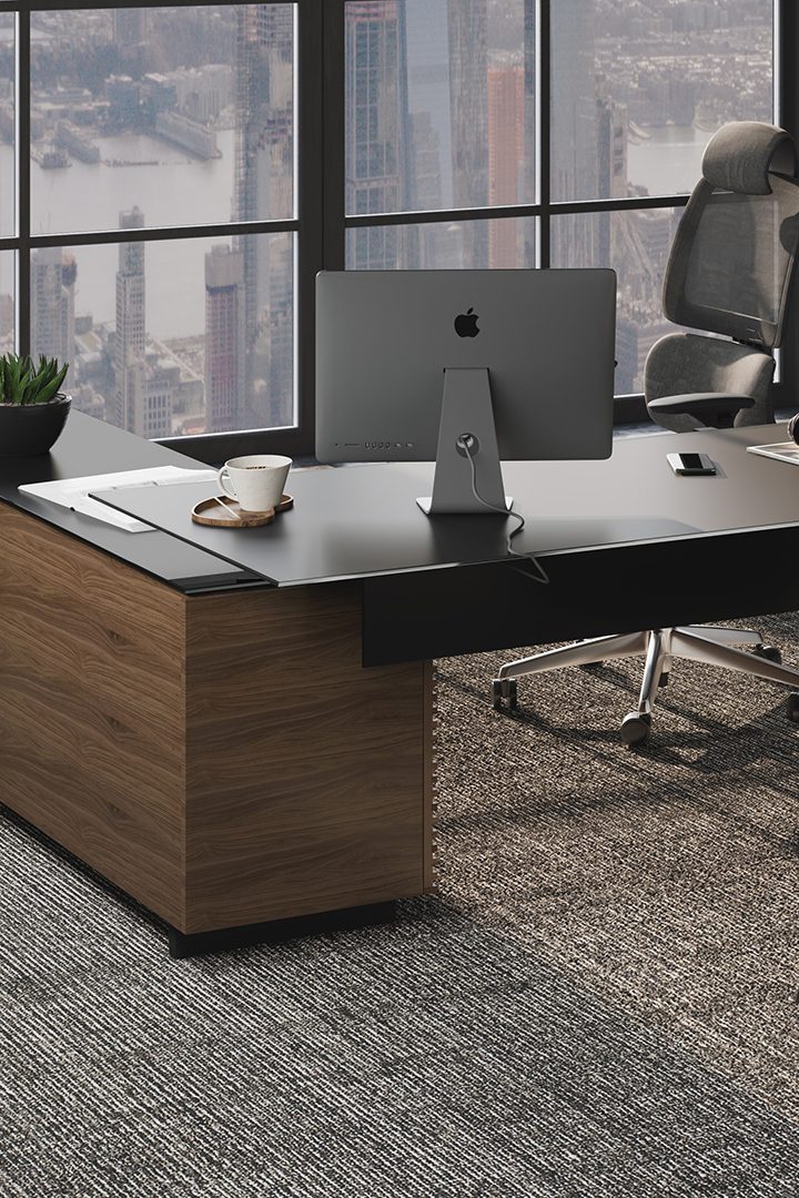 Corridor L-Shaped modern executive desk in natural walnut finish, showcasing integrated cable management.