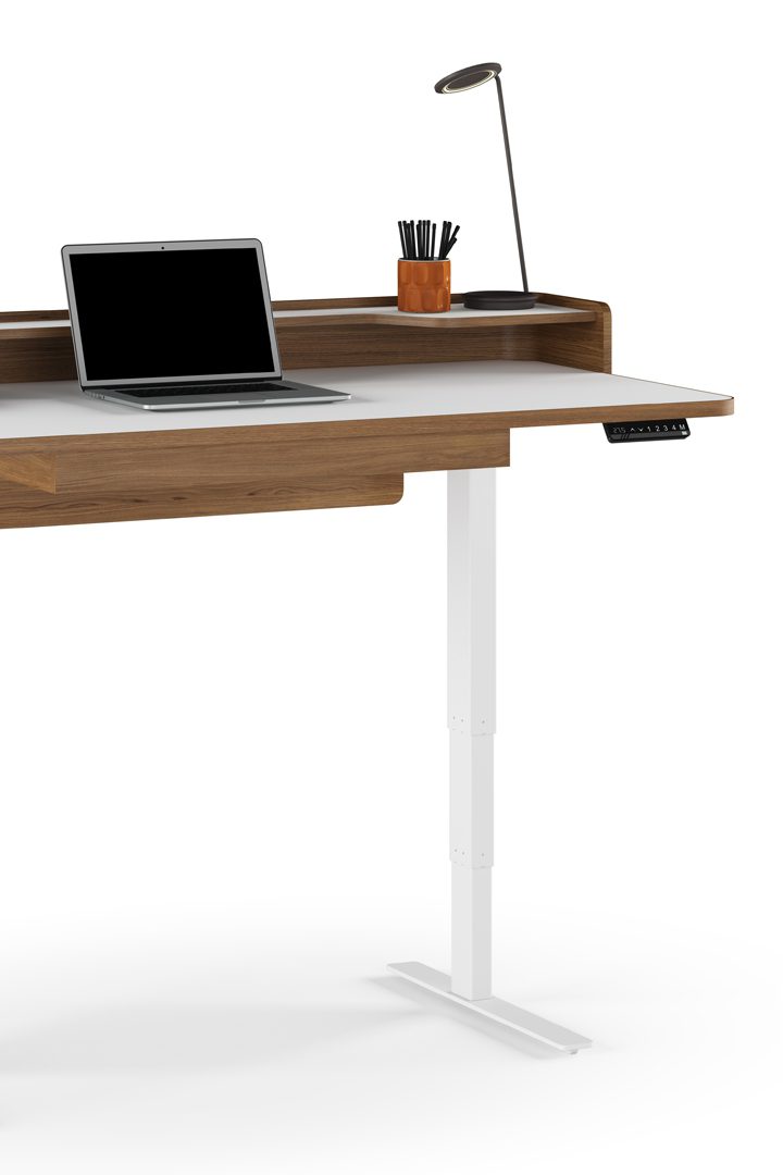 The programmable and height adjustable Kronos Lift Standing Desk in satin white and natural walnut finish in the standing position against a stark white background, and propped with an Apple laptop.