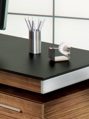 Modern desk from BDI with satin-etched black glass top surface